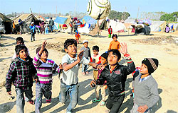 Children play football at Malakpur relief camp in UPs Shamli district