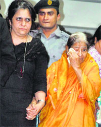 Zakia Jafri (R), wife of Ehsan Jafari, in tears after the court verdict in Ahmedabad on Thursday.