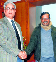 Delhi CM Arvind Kejriwal with CAG Shashi Kant Sharma in New Delhi.