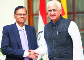 External Affairs Minister Salman Khurshid with his Sri Lankan counterpart Gamini L Peiris in New Delhi on Wednesday