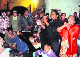 Locals protest against the police at Jagraon on Wednesday