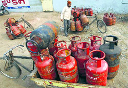 A delivery man at an LPG godown in New Delhi on Thursday.