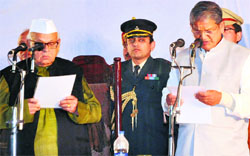 Harish Rawat being administered oath as the eighth Chief Minister of Uttarakhand during a ceremony at Raj Bhawan in Dehradun on Saturday.