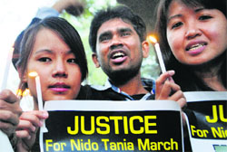 Students hold a candle light vigil in New Delhi on Saturday.