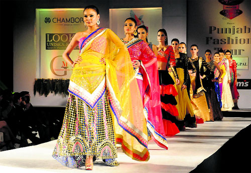 Models walk down the ramp at the CGA Golf Range in Sector 6, Chandigarh, on Sunday.