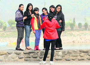 Young girls enjoy an evening at Sukhna Lake in Chandigarh