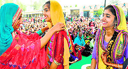 Girls get ready for performance at Daughters Festival at Lobana village on Sunday