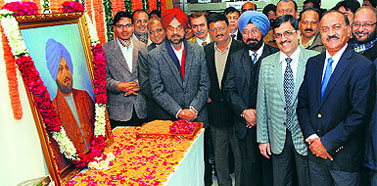 Raj Chengappa, Editor-in-Chief of The Tribune Group of Publications, Vinay Verma, Officiating General Manager, Varinder Walia, Editor of Punjabi Tribune, Santosh Tiwari, Editor of Dainik Tribune, Kanwar Sandhu, Executive Editor, and other employees pay tribute to its founder Sardar Dyal Singh Majithia on the newspapers 133rd anniversary in Chandigarh on Sunday