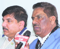 AAP MLA Madan Lal along with party leader Sanjay Singh addresses mediapersons in New Delhi. 