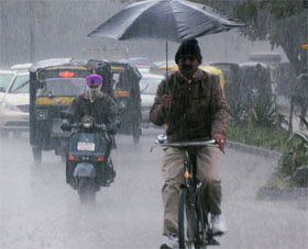 Commuters caught in the rain in Chandigarh on Friday.