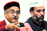 AAP leaders Prashant Bhushan and Gopal Rai address the media in New Delhi on Saturday