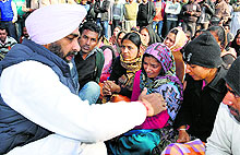 PPP chief Manpreet Singh Badal consoles Kiranjit Kaur, mother of the dead infant, in Bathinda on Saturday