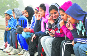 Girls wait for their practice session to start at the PAU on Saturday.