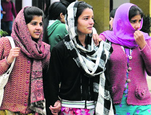 Girls brave cold weather in Chandigarh on Monday.