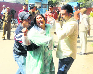 The wailing wife of notorious criminal Jeeta Gujjar on Tuesday.