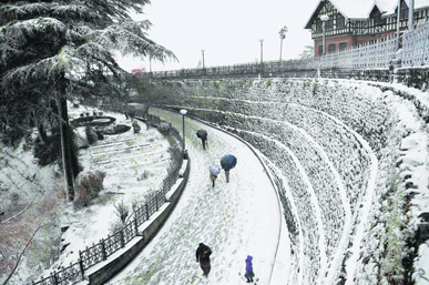 A thick blanket of snow covered Shimla on Friday. Tourists thronged the hill station for celebrations.