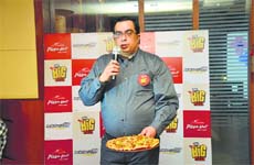 Sunay Bhasin, director, marketing, Pizza Hut India, launching the big pizza