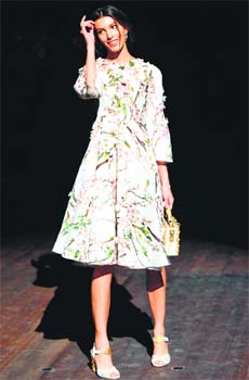 Spring in the step: Canadian model Kate King attends the show of Italian fashion house Dolce & Gabbana as part of the Milan fashion week Autumn/Winter 2014 collection
