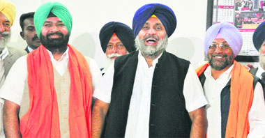 Deputy CM Sukhbir Singh Badal (C) with MLA Jeet Mohinder Singh Sidhu (R) and Malkiat Singh Birmi in Chandigarh.