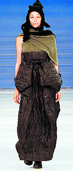 Models present creations by Israeli designer Sasson Kedem during Tel Aviv Fashion Week