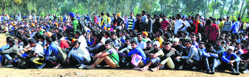 Aspirants wait for their turn during a recruitment drive in Ludhiana on Tuesday.