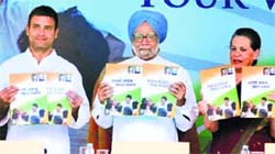 From left: Congress vice-president Rahul Gandhi, PM Manmohan Singh and party chief Sonia Gandhi release the party's election manifesto in New Delhi on Wednesday
