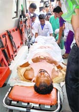 An injured being shifted to a Raipur hospital after a Maoist attack on a poll team in Bijapur on Saturday.