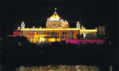 A view of illuminated Takht Shri Keshgarh Sahib on the eve of Baisakhi at Anandpur Sahib on Sunday