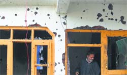 Bullet marks on a house in the Ahmad Nagar area where the 20-hour gunfight took place.