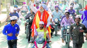 AAP candidate HS Phoolka takes out a rally in Ludhiana.