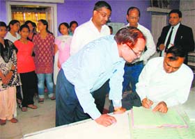 Panchkula District and Sessions Judge RK Sondhi (sitting extreme right) checks a register at Bal Niketan, Sector 2, Panchkula, on Friday