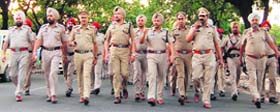Police officials hold a flag march in Mohali to instill confidence among the residents