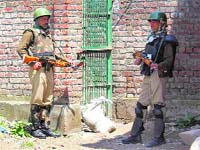 A securityman at the site of the first attack in Srinagar