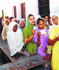 Women queue up at a polling station in Mann village, Bathinda, on Wednesday