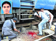 Members of the bomb squad inspect the train after the blasts in Chennai on Thursday.