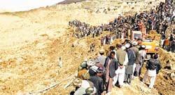 Afghan villagers at a landslide site in Badakhshan province on Saturday.