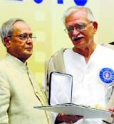 President Pranab Mukherjee presents the Dadasaheb Phalke Award to lyricist-director Gulzar in New Delhi on Saturday.