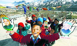 Children play with poll campaign material in Kaza, HP, on Tuesday