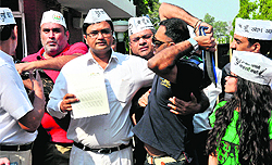 Members of two groups of the Aam Aadmi Party indulge in a scuffle outside the Punjab Raj Bhawan where one of the groups had gone to submit a memorandum to the UT Administrator regarding demolition notices sent to colonies in Chandigarh on Wednesday