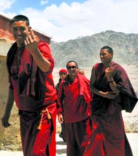 Monks come out of a polling booth at Thiksey monastery in Leh on Wednesday