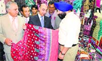 Pakistan High Commissioner Abdul Basit (C) at a stall at Pakistan Show in Amritsar on Thursday. Photo: Vishal Kumar 