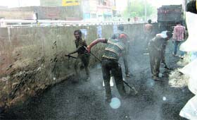 Recarpeting work in progress in rain at Khanna