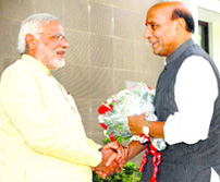 BJP chief Rajnath Singh with party's PM nominee Narendra Modi in Gandhinagar