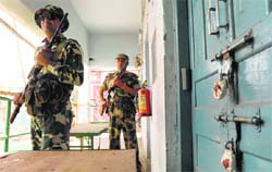 Security men guard a strongroom holding EVMs ahead of counting of votes in Amritsar.