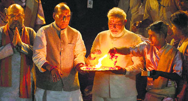 BJP PM designate Narendra Modi performs Ganga Aarti along with party leaders Rajnath Singh and Amit Shah in Varanasi. 