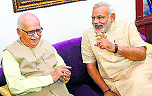 BJPs PM-designate Narendra Modi with party leader LK Advani in New Delhi on Sunday