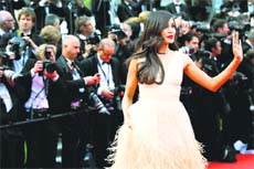 Cynosure of all eyes : Actress Freida Pinto poses as she arrives for the screening of Saint-Laurent at the 67th International Film Festival, Cannes, Southern France