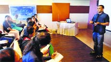 Santosh Joshi (R) addresses participants in a workshop
