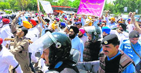 Sikhs protest outside Parliament in Sindh.