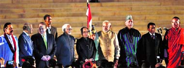 Sri Lanka's President Mahinda Rajapaksa, Mauritius PM Navinchandra Ramgoolam, Pakistan's PM Nawaz Sharif, Vice President Hamid Ansari, President Pranab Mukherjee, Prime Minister Narendra Modi, Afghanistan's President Hamid Karzai, Maldives President Abdulla Yameen and Bhutan PM Tshering Tobgay pose for a group photo after swearing-in at Rashtrapati Bhavan in New Delhi on Monday.